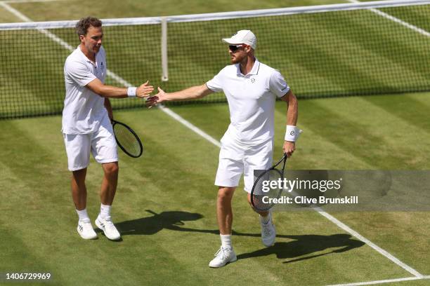 Bruno Soares of Brazil and partner Jamie Murray of Great Britain celebrate a point against John Peers of Australia and Filip Polasek of Slovakia...