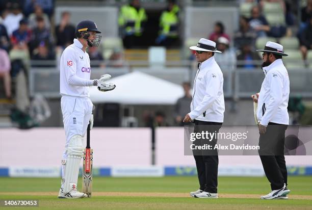 Zak Crawley of England speaks to umpires Richard Kettleborough and Aleem Darr after they gave the soft signal as out for a bump ball during Day Four...