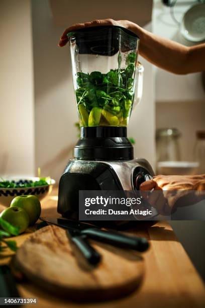 it's always a good time for a healthy and fresh green detox smoothie - liquidiser stock pictures, royalty-free photos & images