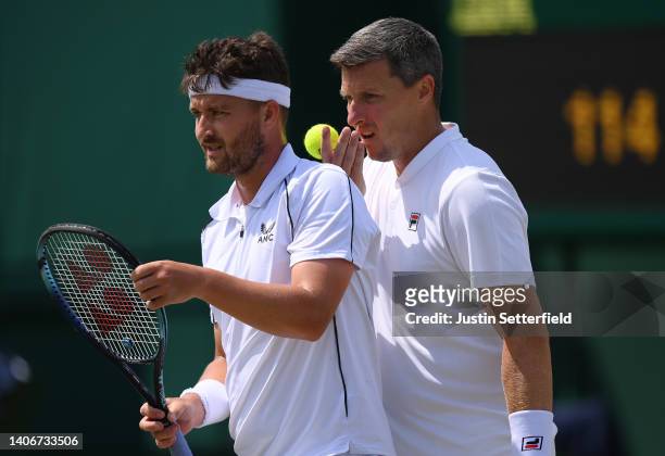Jonny O'Mara of Great Britain interacts with partner Ken Skupski of Great Britain against Kevin Krawietz of Germany and Andreas Mies of Germany...