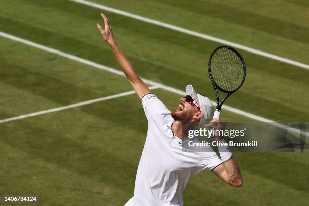 Jamie Murray of Great Britain serves with partner Bruno Soares of Brazil against John Peers of Australia and Filip Polasek of Slovakia during their...