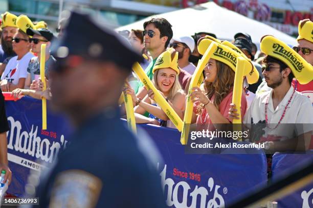 Spectators cheer ahead of the 2022 Nathans Famous Fourth of July International Hot Dog Eating Contest at Coney Island on July 04, 2022 in the...