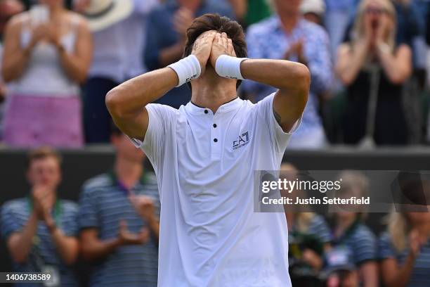 Cristian Garin of Chile celebrates after winning match point against Alex de Minaur of Australia during their Men's Singles Fourth Round match on day...