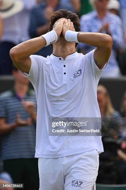 Cristian Garin of Chile celebrates after winning match point against Alex de Minaur of Australia during their Men's Singles Fourth Round match on day...