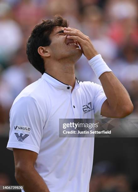 Cristian Garin of Chile celebrates after winning match point against Alex de Minaur of Australia during their Men's Singles Fourth Round match on day...