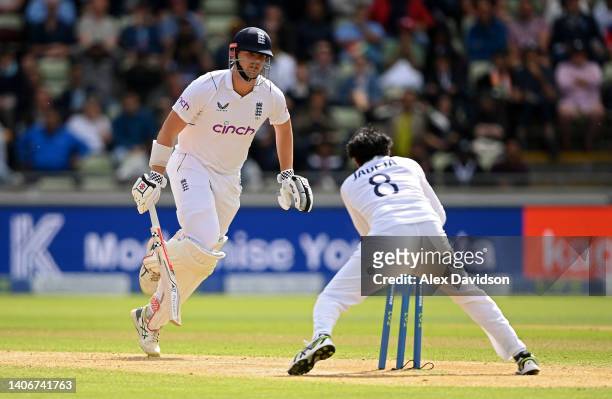 Alex Lees of England watches on as he is run out by Ravindra Jadeja of India during Day Four of the Fifth Lv=Insurance Test Match at Edgbaston on...