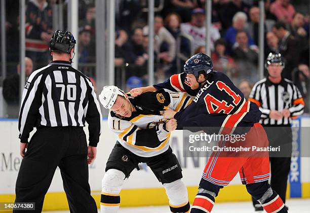 Gregory Campbell of the Boston Bruins and Stu Bickel of the New York Rangers fight during the game at Madison Square Garden on March 4, 2012 in New...