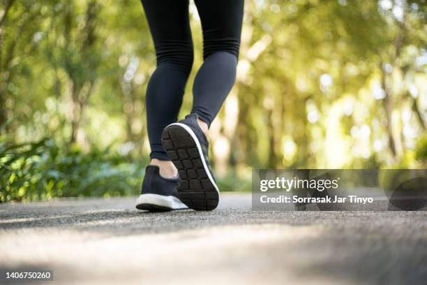 close up of young athlete women feet in running activity - endurance walking stock pictures, royalty-free photos & images