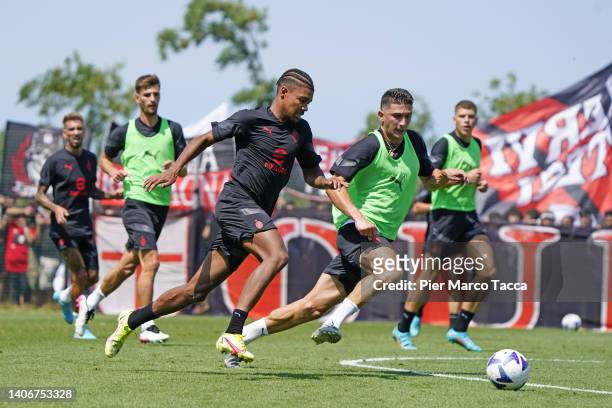 Emil Roback and Mattia Caldara in action during an AC Milan training session at Milanello on July 04, 2022 in Cairate, Italy.