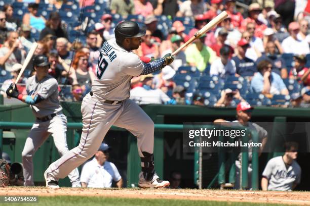 Jesus Aguillar of the Miami Marlins singles in Luke Williams in the third inning during a baseball game against Washington Nationals at Nationals...