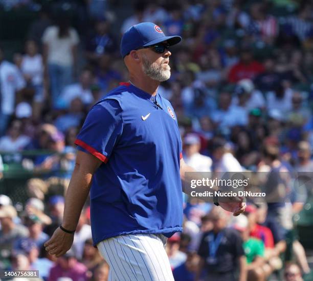 Manager David Ross of the Chicago Cubs walks on the field after making a pitching change during a game against the Boston Red Sox at Wrigley Field on...