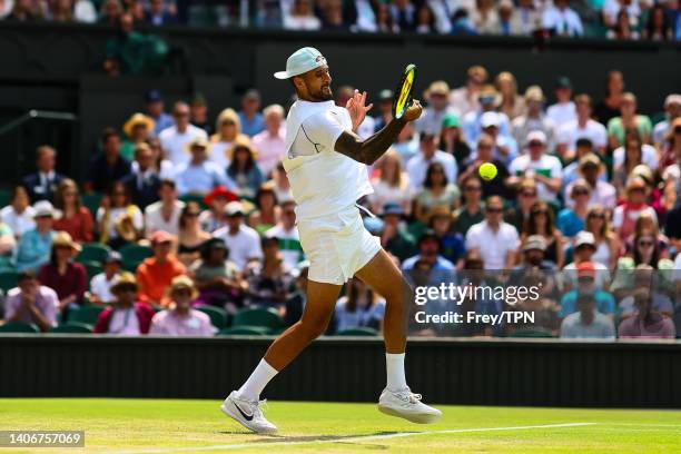 Nick Kyrgios of Australia hits a forehand against Brandon Nakashama of the United States during day eight of The Championships Wimbledon 2022 at All...