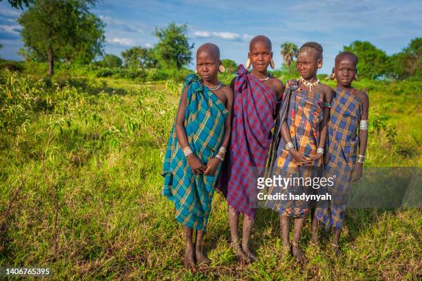 young girls from mursi tribe, ethiopia, africa - mursi tribe they stock pictures, royalty-free photos & images