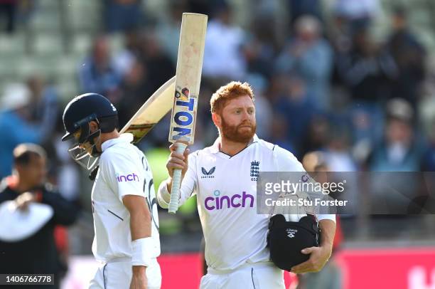England batsmen Jonny Bairstow and Joe Root acknowledge the applause as they leave the field not out at the end of day four of the Fifth test match...