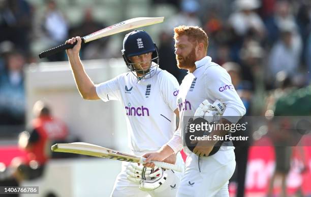 England batsmen Jonny Bairstow and Joe Root acknowledge the applause as they leave the field not out at the end of day four of the Fifth test match...