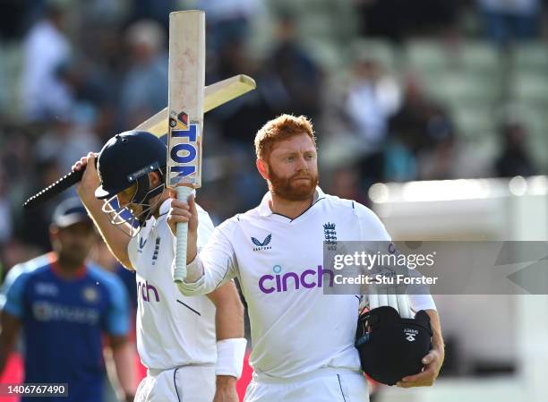 England batsmen Jonny Bairstow and Joe Root acknowledge the applause as they leave the field not out at the end of day four of the Fifth test match...