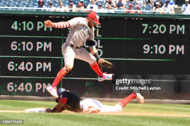 Ehire Adrianza of the Washington Nationals steals second on Miguel Rojas of the Miami Marlins in the eighth inning during a baseball game at...