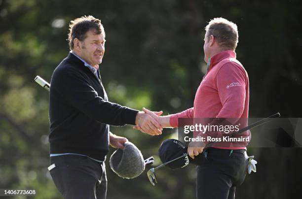 Sir Nick Faldo , shakes hands with Jamie Donaldson of Wales as they finish their round during Day One of the JP McManus Pro-Am at Adare Manor on July...