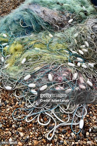 fishing nets, and floats. - aldeburgh stock pictures, royalty-free photos & images