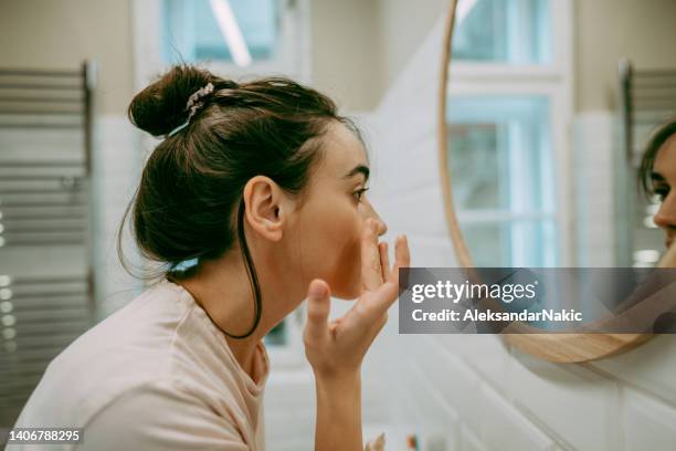 moisturizing is important - messy hair bun stock pictures, royalty-free photos & images