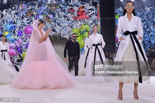 Bianca Brandolini d'Adda and designer Giambattista Valli walk the runway during the Giambattista Valli Haute Couture Fall Winter 2022 2023 show as...