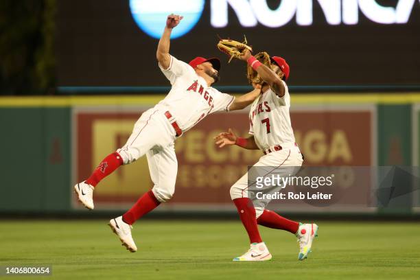 Jack Mayfield and Jo Adell of the Los Angeles Angels collide during the game against the Boston Red Sox at Angel Stadium of Anaheim on June 8, 2022...