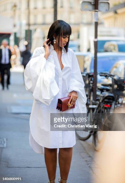 Sabrina Elba is seen wearing white dress outside Schiaparelli during Paris Fashion Week - Haute Couture Fall Winter 2022 2023 : Day One on July 04,...