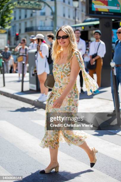 Sabina Socol is seen wearing yellow dress with floral print, Chanel shooes outside Iris Van Herpen during Paris Fashion Week - Haute Couture Fall...