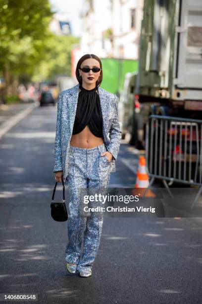 Mary Leest is seen wearing silver blazer, pants, black cropped top, bag outside Iris Van Herpen during Paris Fashion Week - Haute Couture Fall Winter...