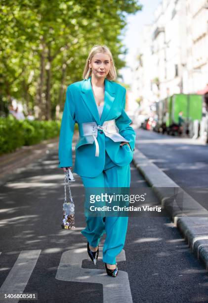 Justyna Czerniak seen wearing corset, turquoise oversized suit, Paco Rabanne bag outside Iris Van Herpen during Paris Fashion Week - Haute Couture...