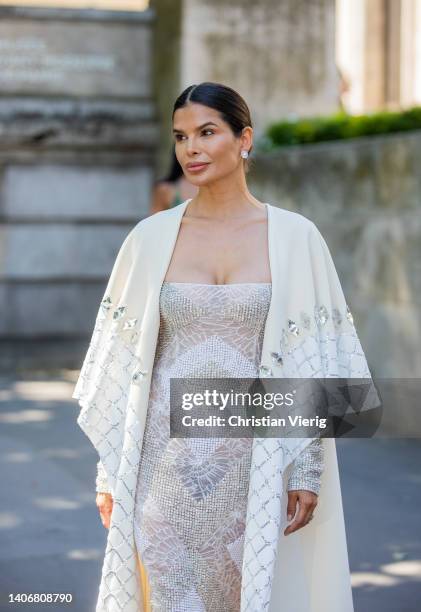 Victoria Barbara seen wearing creme white cape, off shoulder dress outside Georges Hobeika during Paris Fashion Week - Haute Couture Fall Winter 2022...