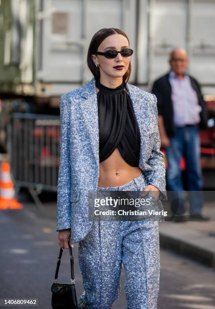 Mary Leest is seen wearing silver blazer, pants, black cropped top outside Iris Van Herpen during Paris Fashion Week - Haute Couture Fall Winter 2022...