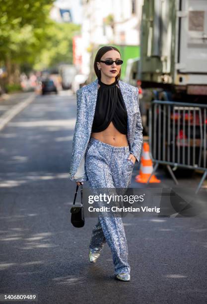 Mary Leest is seen wearing silver blazer, pants, black cropped top outside Iris Van Herpen during Paris Fashion Week - Haute Couture Fall Winter 2022...