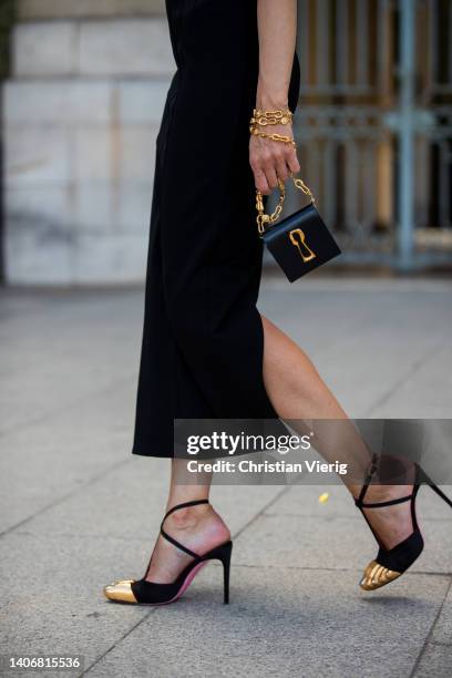 Sabina Jakubowicz seen on her way to Schiaparelli cocktail wearing black dress, golden earrings, bag, heels during Paris Fashion Week - Haute Couture...