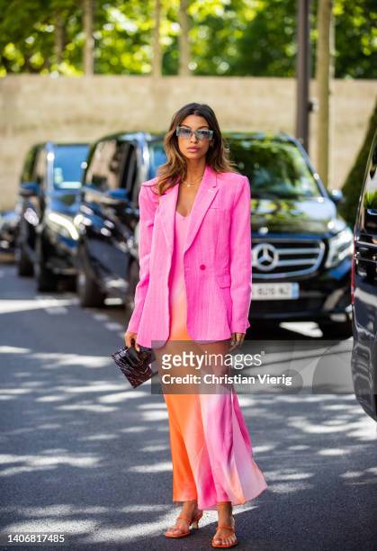 Guest is seen wearing pink blazer, multi colored dress outside Tony Ward during Paris Fashion Week - Haute Couture Fall Winter 2022 2023 : Day One on...