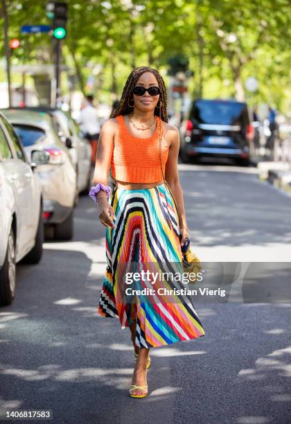 Guest is seen wearing multi colored skirt, orange cropped top, yellow Bottega Veneta bag outside Tony Ward during Paris Fashion Week - Haute Couture...