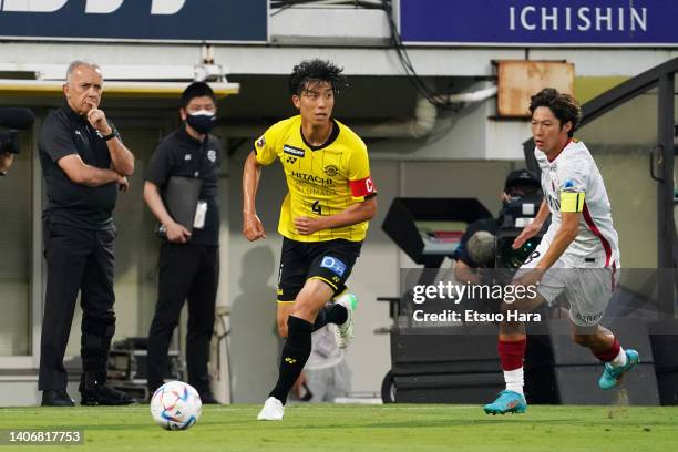 Taiyo Koga of Kashiwa Reysol in action under pressure from Shoma Doi of Kashima Antlers during the J.LEAGUE Meiji Yasuda J1 19th Sec. Match between...