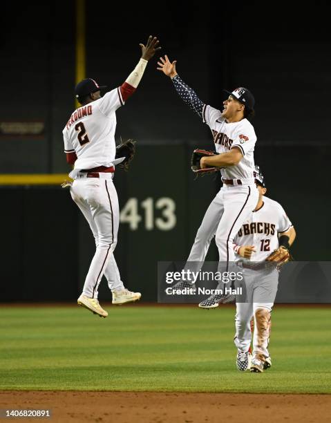 Alek Thomas and Geraldo Perdomo of the Arizona Diamondbacks celebrate an 8-3 win against the San Francisco Giants at Chase Field on July 04, 2022 in...