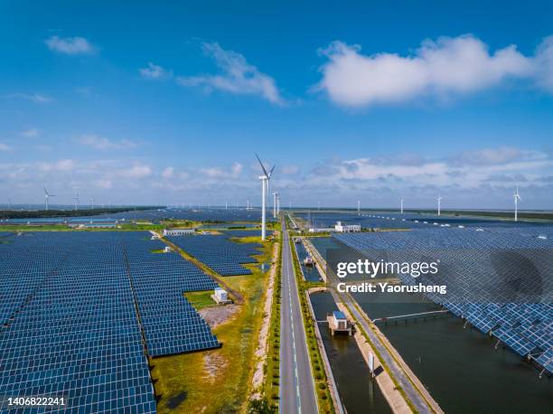 aerial view of solar power stations and wind turbines,mixed new green energy - alternative fuel vehicle stock-fotos und bilder