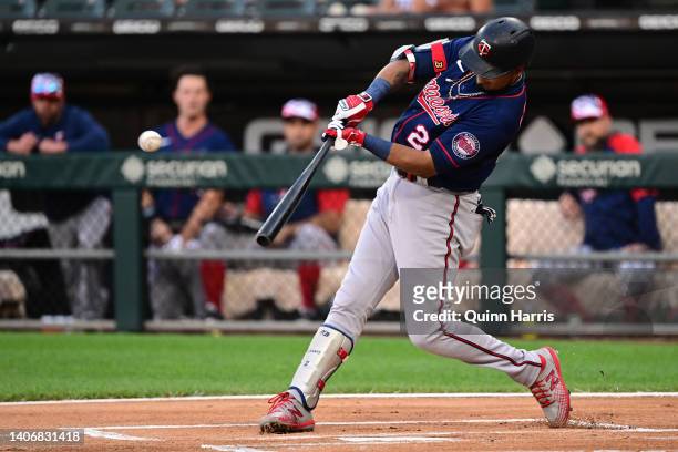 Luis Arraez of the Minnesota Twins hits a double in the first inning against the Chicago White Sox at Guaranteed Rate Field on July 04, 2022 in...