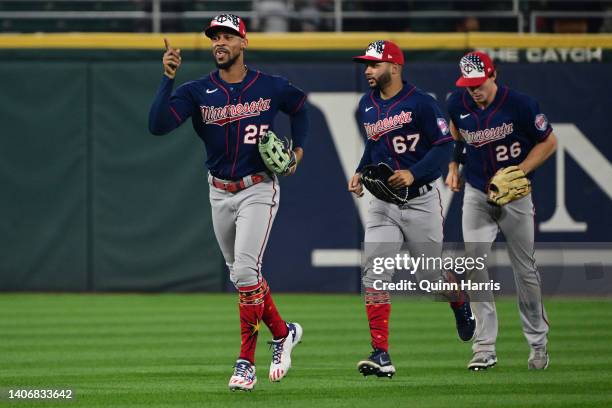 Byron Buxton of the Minnesota Twins celebrates with Gilberto Celestino and Max Kepler of the Minnesota Twins after the 6-3 win against the Chicago...