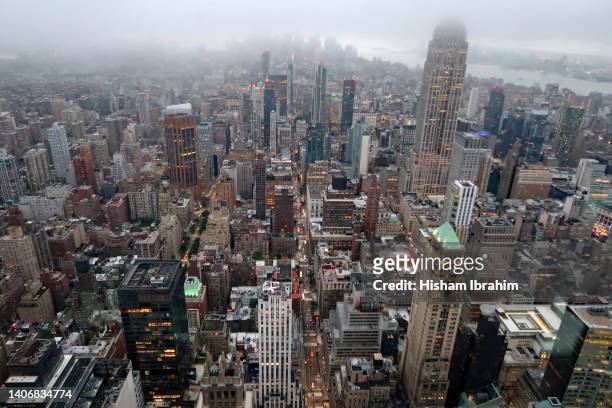aerial view of midtown manhattan during a foggy rainy sunset, manhattan, new york city. - aerial view of mid town manhattan new york stock pictures, royalty-free photos & images