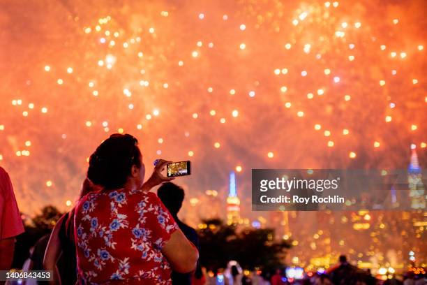 Spectators gather at Gantry Plaza State Park in Queens to watch to 2022 Macy's fireworks display on July 04, 2022 in New York City.