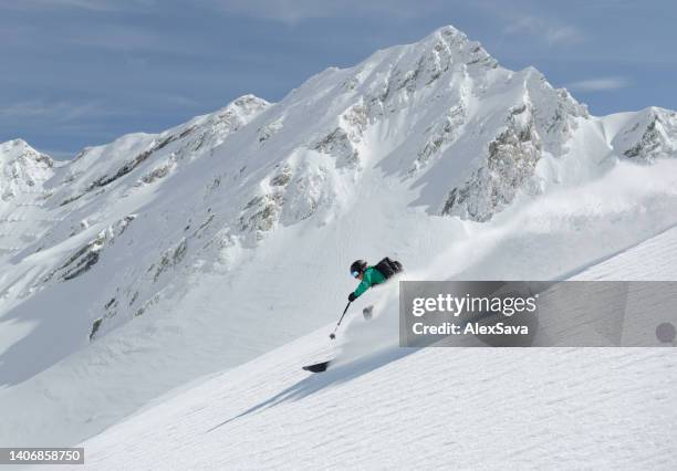 fast alpine skier - back country skiing stock pictures, royalty-free photos & images