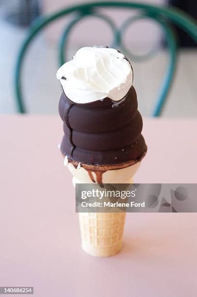 chocolate dipped ice cream cone - frost bite stock-fotos und bilder