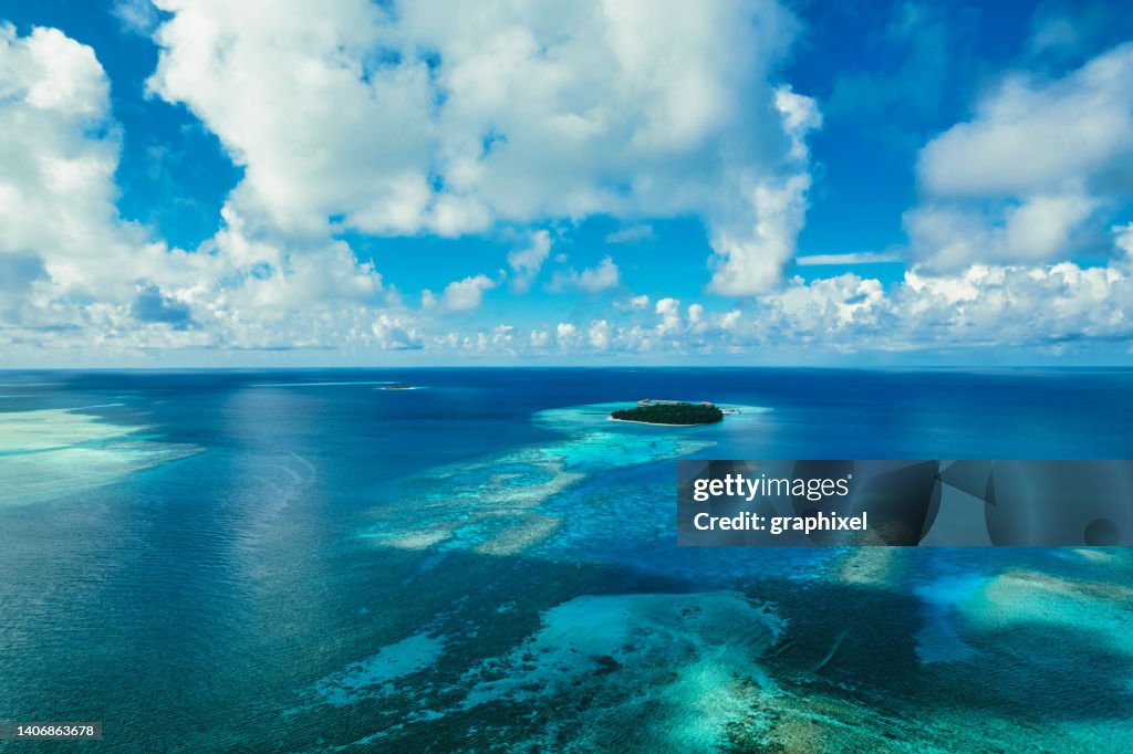 Shallow View Aerial View Of Tropical Island And Shallow Reef Lagoon High-Res Stock ...