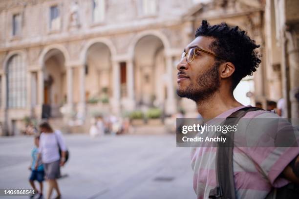 male solo traveler exploring the city - milan landmark stock pictures, royalty-free photos & images