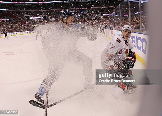 Brian Campbell of the Florida Panthers moves in to hit Kyle Turris of the Ottawa Senators at the BankAtlantic Center on March 4, 2012 in Sunrise,...