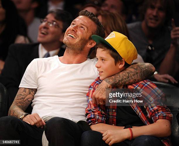 David Beckham and son Brooklyn Beckham take in the game between the Miami Heat and the Los Angeles Lakers at Staples Center on March 4, 2012 in Los...
