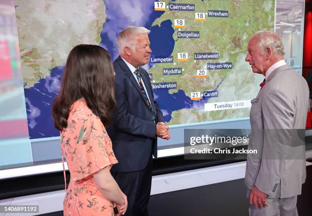 Meteorologist, Derek Brockway and Prince Charles, Prince of Wales speak during a visit to BBC Wales’s new Headquarters on July 05, 2022 in Cardiff,...